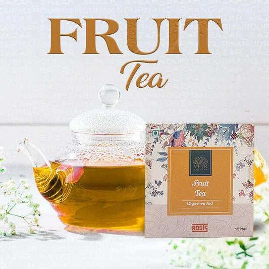 Refreshing fruit tea with assorted fresh fruits in a glass pitcher