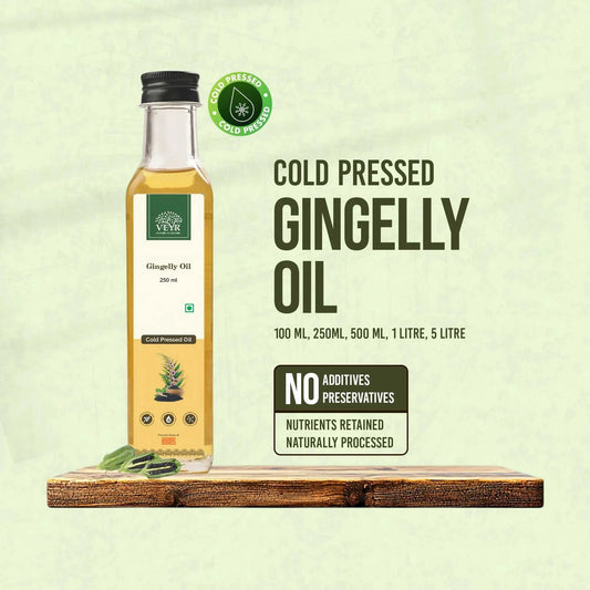 Cold pressed gingelly oil bottles from Raaki Eco Farm showcasing organic sesame seed oil in glass and tin containers