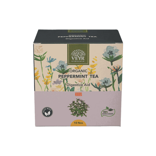 Refreshing peppermint tea in a clear glass cup with fresh mint leaves